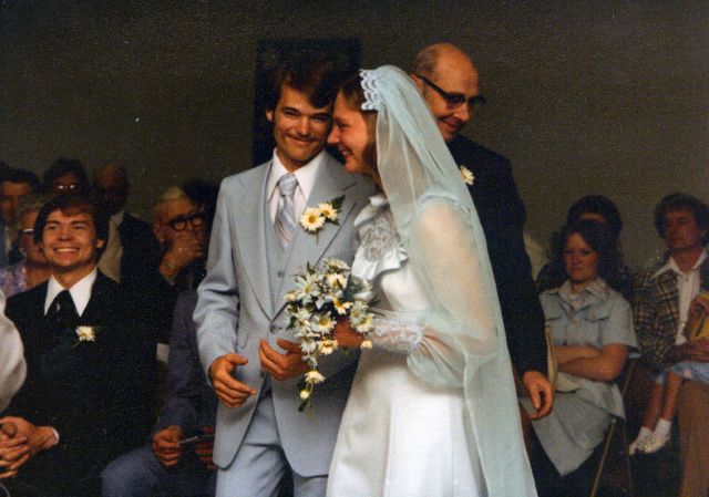 Harold walks Marcia to the front