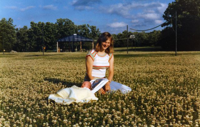 Tim and Marcia enjoying the clover before I mow the field