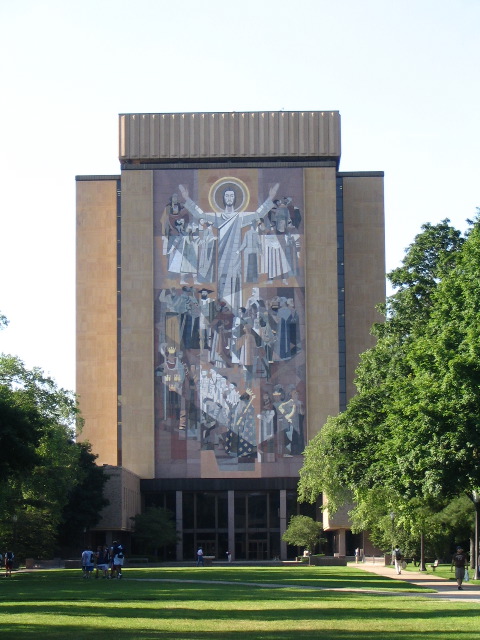 ND Library with Christian mural, including Jesus with arms at the top. From the football field, his arms align with the goal posts
