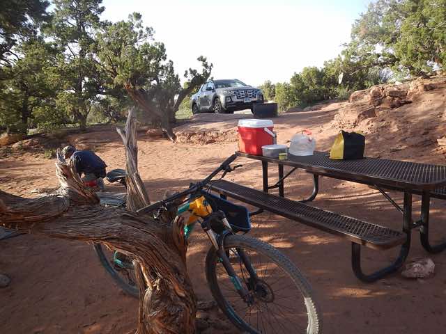 I am setting up my tent at our new campsite