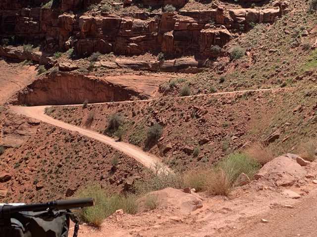 Bikers coming up on road in upper portion